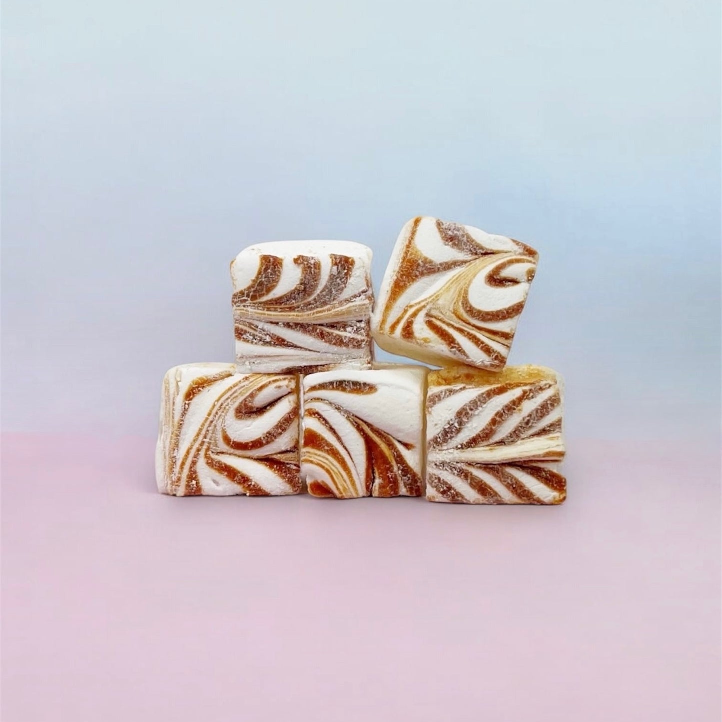Marbled caramel marshmallows on a gradient background