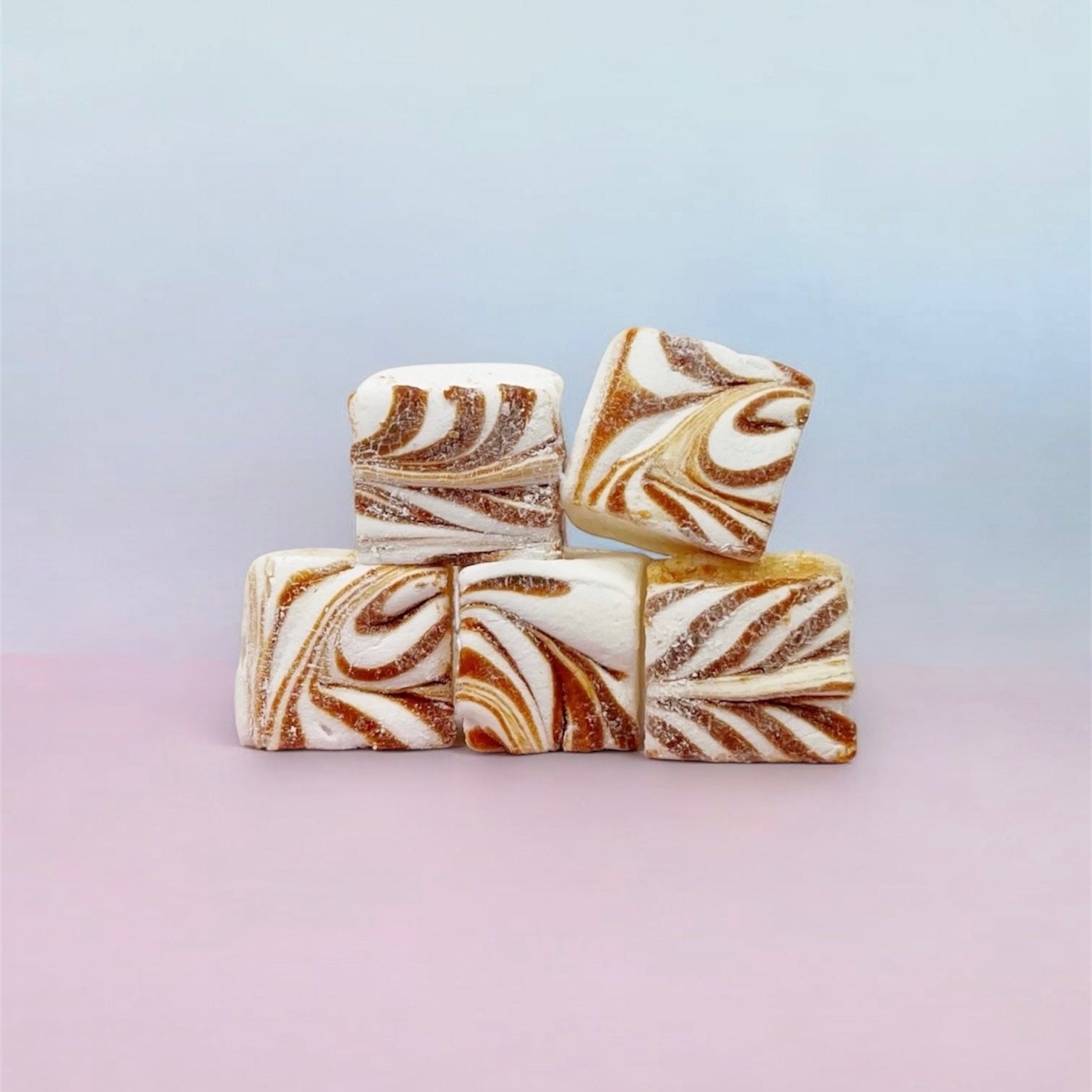Marbled caramel marshmallows on a gradient background
