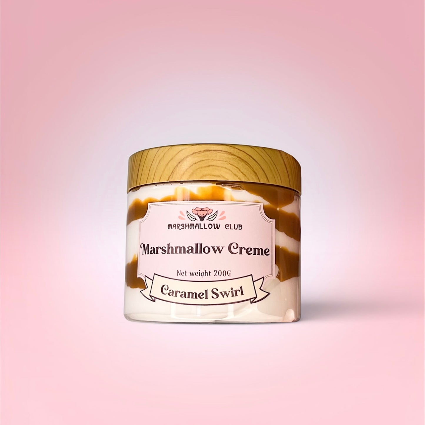 Jar of Marshmallow Creme with Caramel Swirl on a pink background