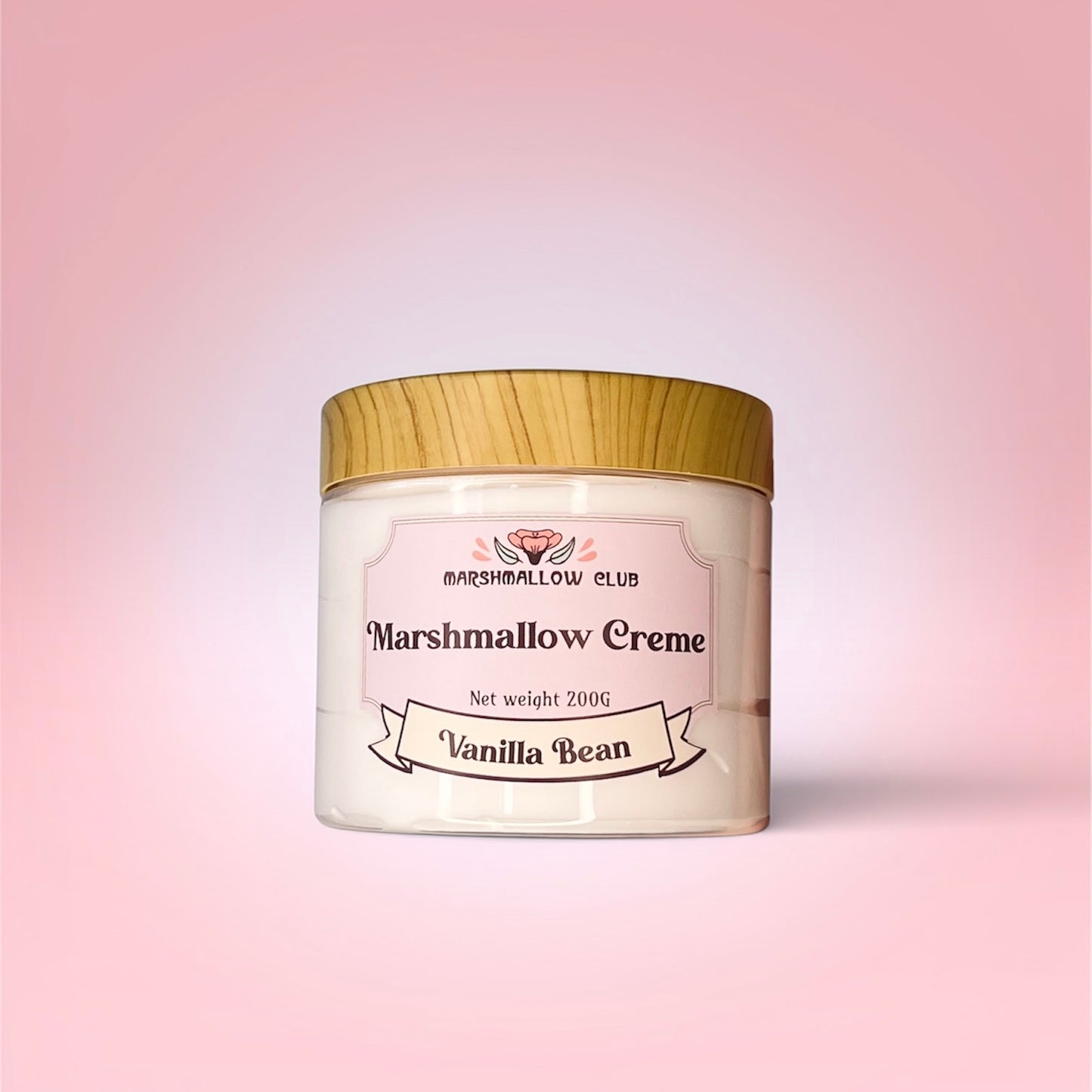 Jar of Marshmallow Creme Vanilla Bean on a pink background